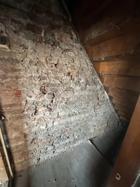 Masonry beside the staircase