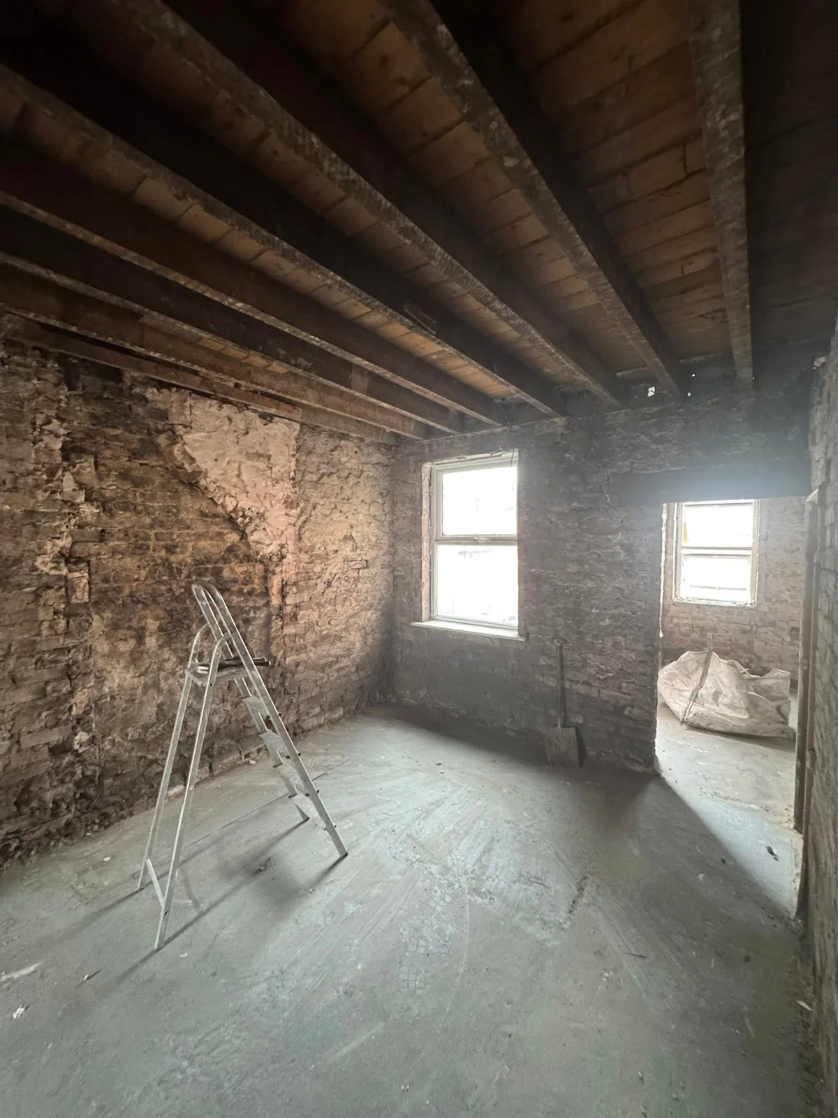Room stripped to its underlying surfaces